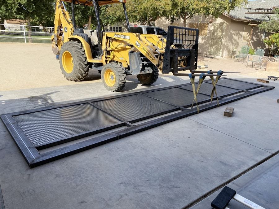 Backhoe and gate fabrication on site